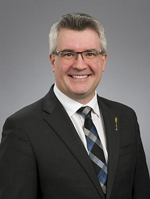 Hon. Kris AUSTIN